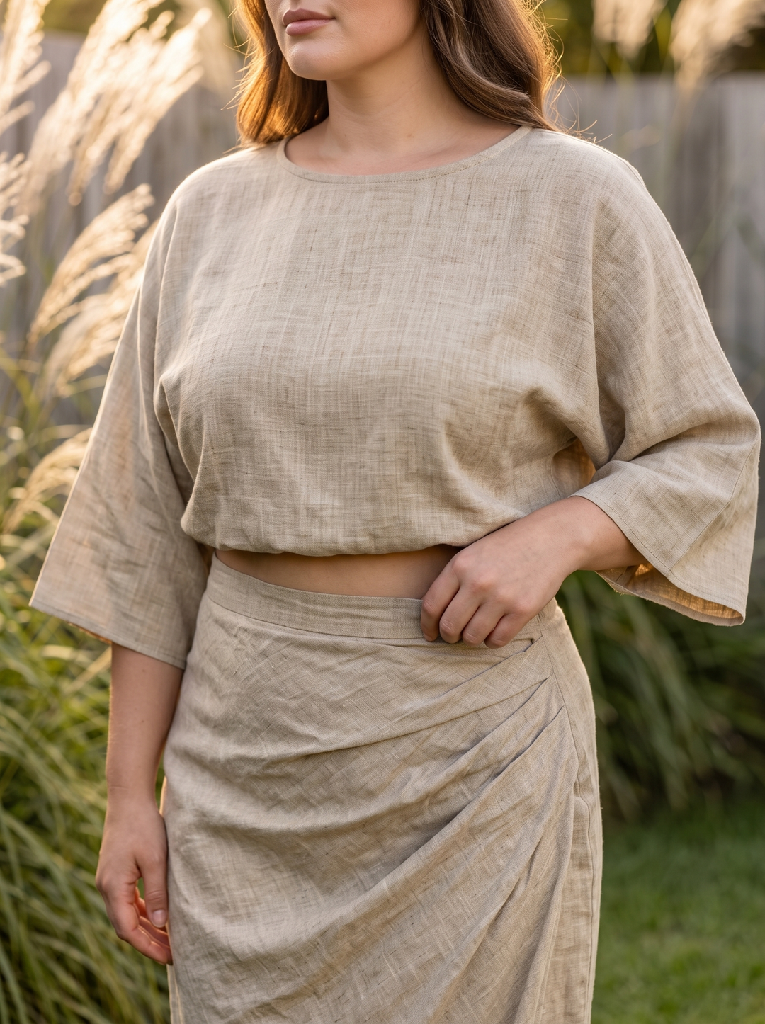 Close detail of the batwing sleeve and draped skirt