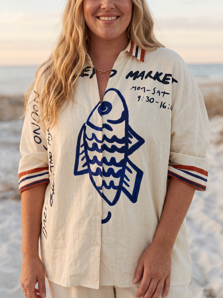 Close detail of the camp collar and fish graphic